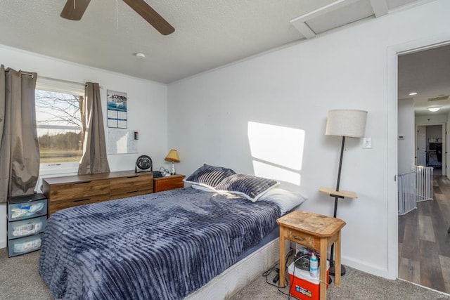 bedroom featuring a textured ceiling, hardwood / wood-style flooring, and ceiling fan