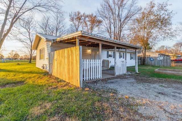 view of outbuilding with a lawn