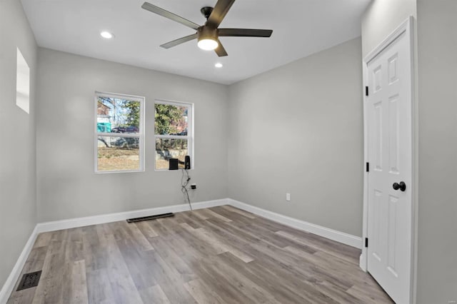 unfurnished room featuring ceiling fan and light hardwood / wood-style flooring