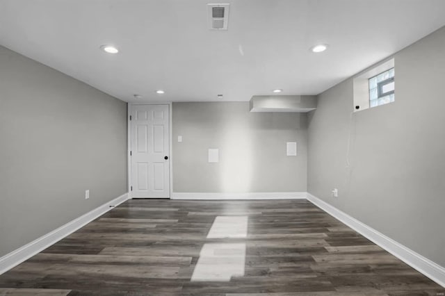 basement featuring dark wood-type flooring