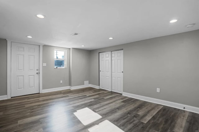 basement featuring dark hardwood / wood-style floors