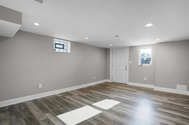 basement with dark wood-type flooring