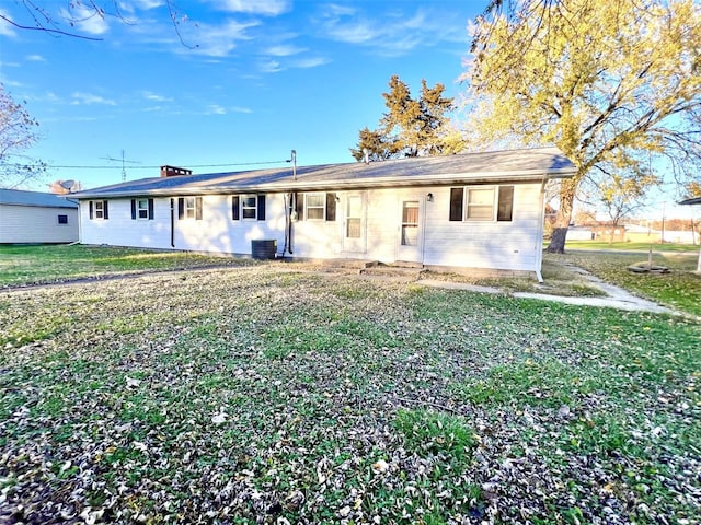 view of front of house with cooling unit and a front yard