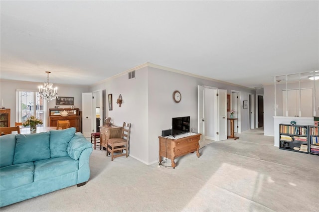 carpeted living room featuring ornamental molding and an inviting chandelier