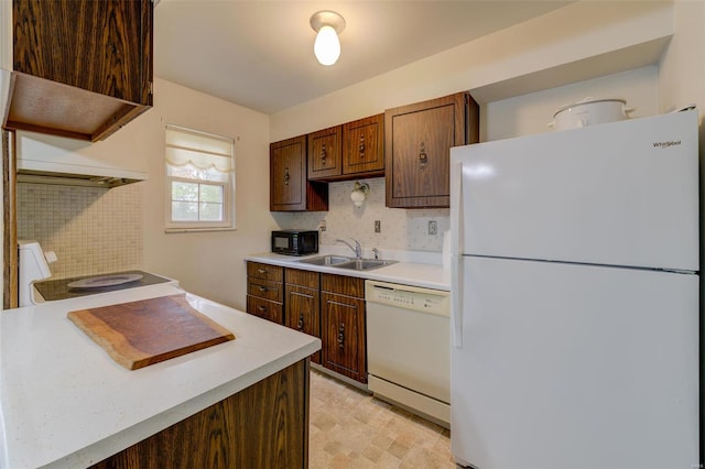 kitchen with white appliances and sink