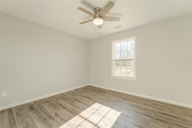 unfurnished room with light hardwood / wood-style flooring and ceiling fan