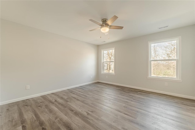 unfurnished room with light hardwood / wood-style floors and ceiling fan