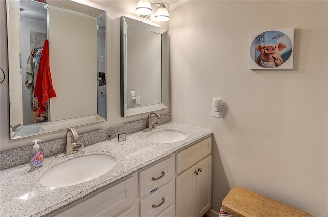 bathroom with vanity and ornamental molding