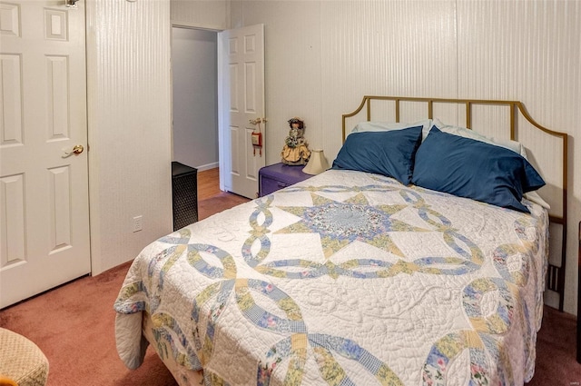 bedroom featuring dark colored carpet