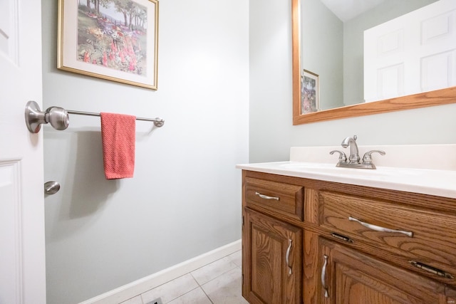 bathroom with tile patterned flooring and vanity