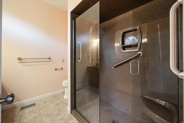 bathroom with tile patterned floors, toilet, and walk in shower