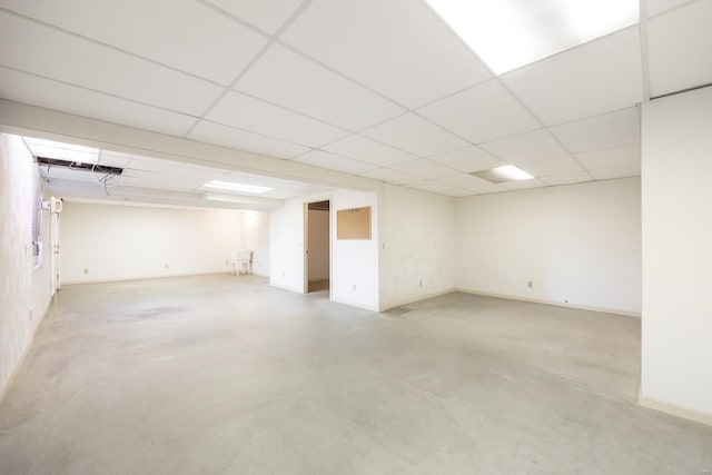 basement featuring a paneled ceiling