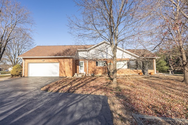 ranch-style home featuring a garage