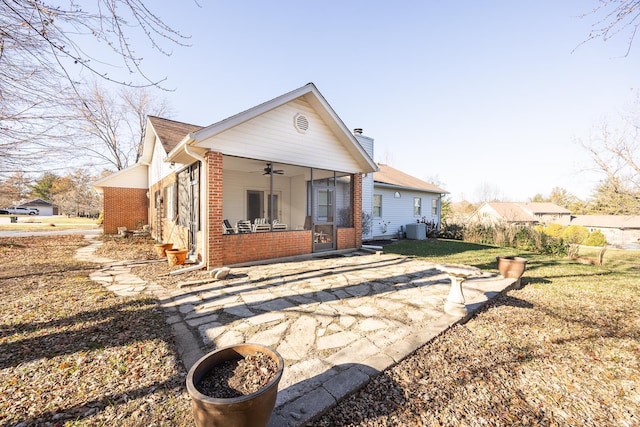 back of property featuring central AC and ceiling fan