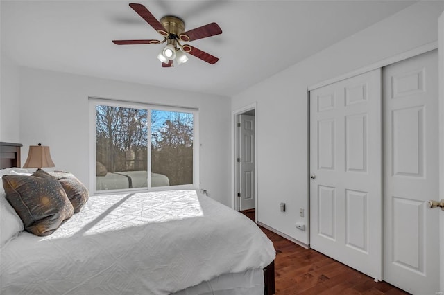 bedroom featuring ceiling fan, access to exterior, and dark hardwood / wood-style flooring