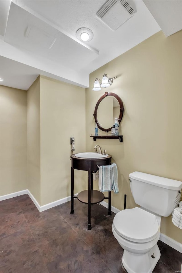 bathroom featuring sink and toilet