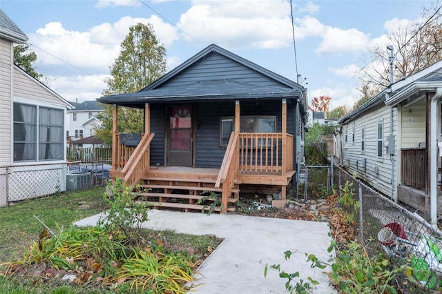 bungalow-style home featuring central AC unit