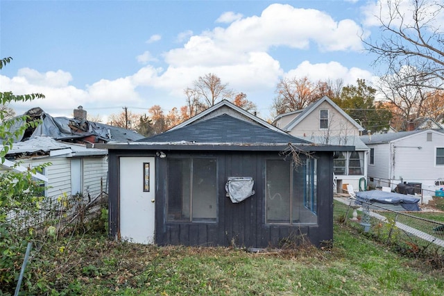 view of side of property featuring an outbuilding