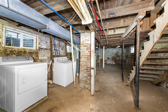 basement with washer and clothes dryer