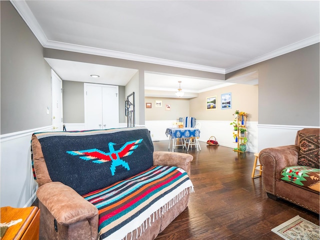 living room featuring crown molding and dark hardwood / wood-style flooring