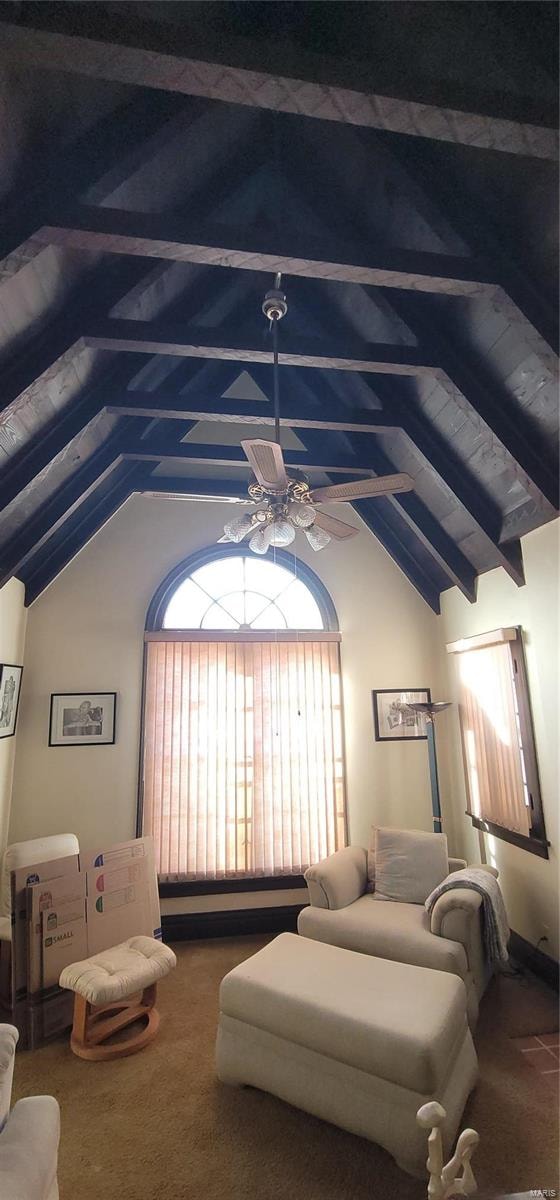 carpeted bedroom featuring ceiling fan and vaulted ceiling