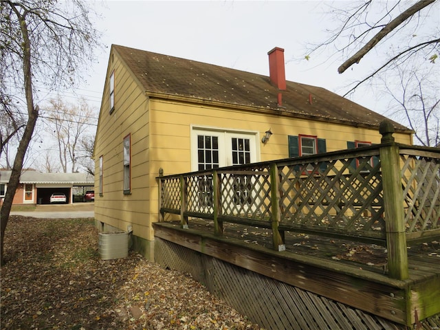 back of house featuring a wooden deck