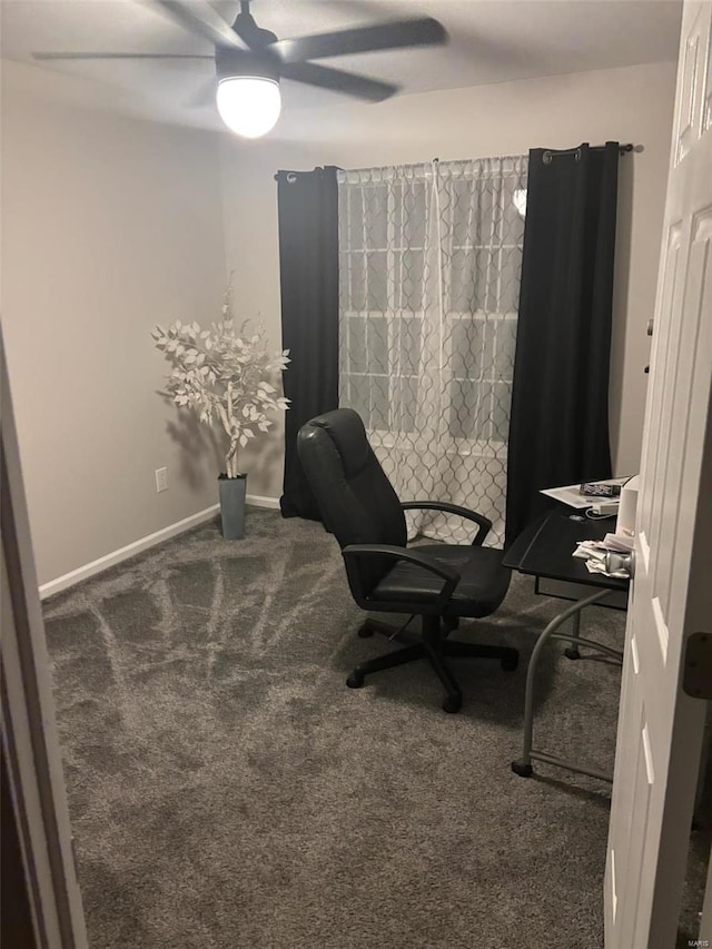 office space featuring dark colored carpet and ceiling fan