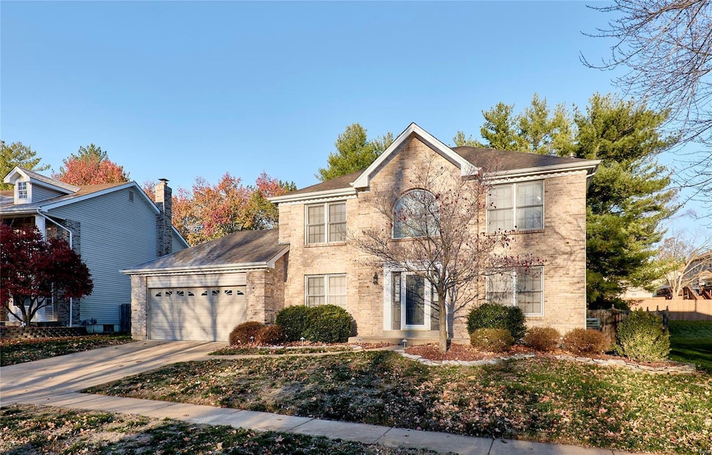 colonial inspired home featuring a garage