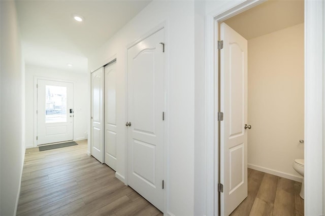 hallway with light wood-type flooring