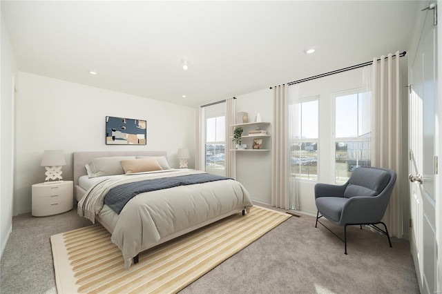 bedroom with light colored carpet