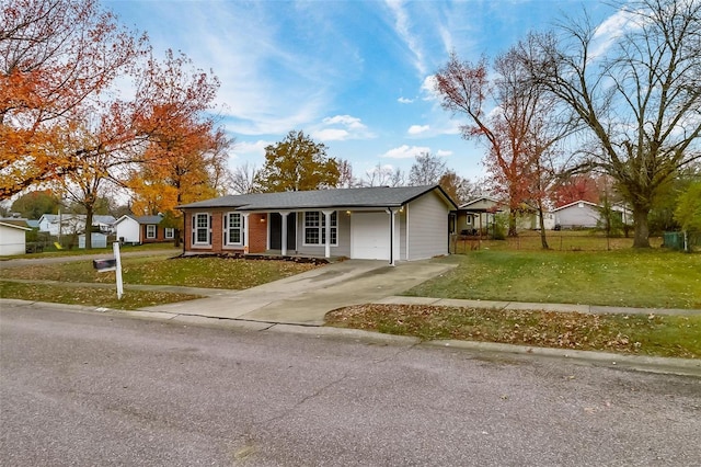 ranch-style home with a front lawn and a garage