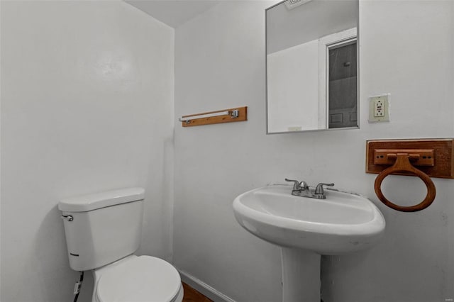 bathroom featuring toilet