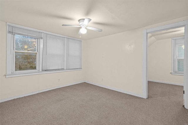 unfurnished room with light colored carpet, ceiling fan, and lofted ceiling