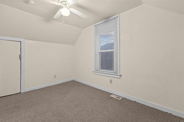 bonus room with ceiling fan, carpet floors, and lofted ceiling