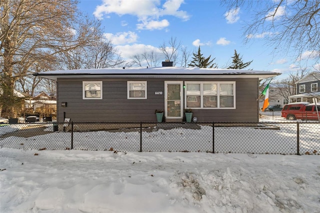 view of snow covered house