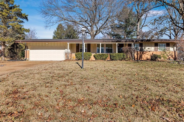 single story home featuring a garage and a front lawn