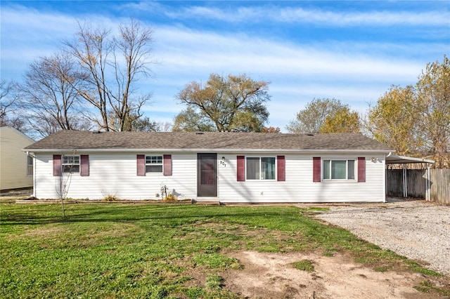 single story home with a carport and a front yard