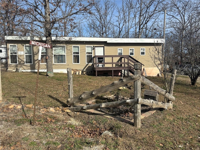 back of house with a wooden deck