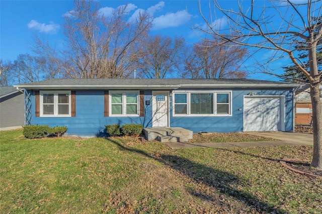 single story home featuring a garage and a front lawn