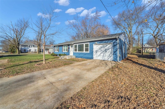 view of front of home featuring a front yard and a garage