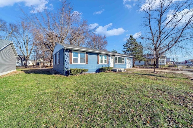 ranch-style home featuring a front yard