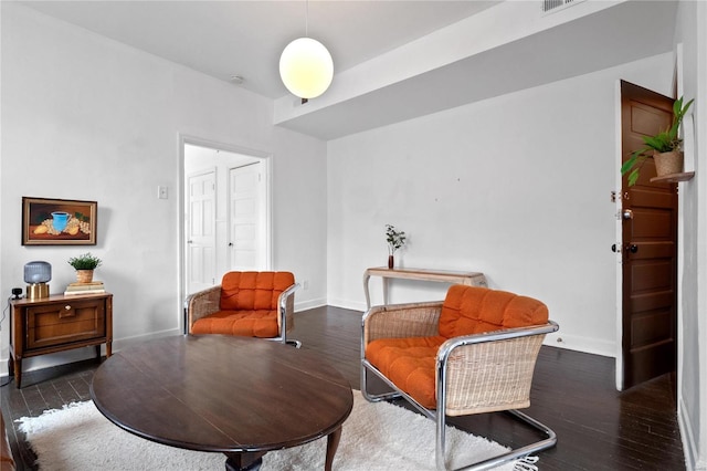 living area with dark wood-type flooring