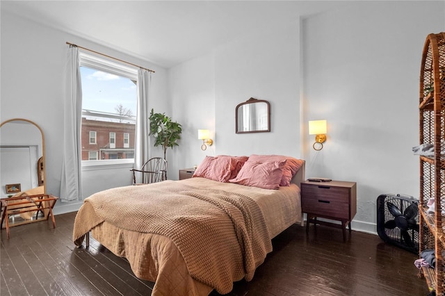 bedroom featuring dark hardwood / wood-style flooring