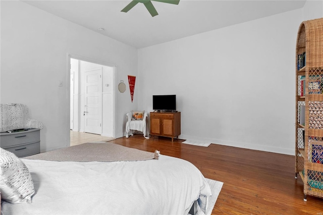 bedroom with ceiling fan and hardwood / wood-style floors