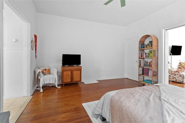 bedroom with hardwood / wood-style floors and ceiling fan