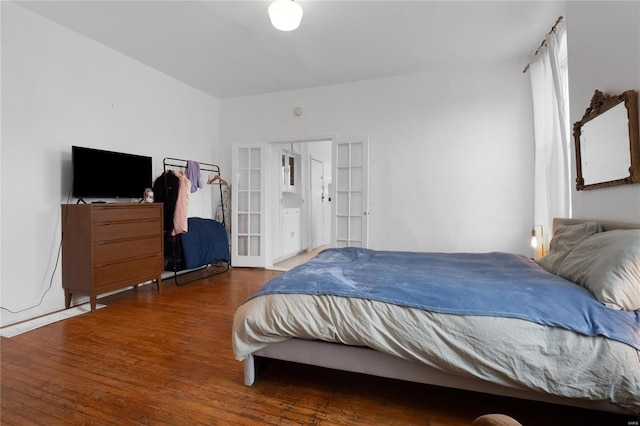 bedroom featuring french doors and dark hardwood / wood-style floors