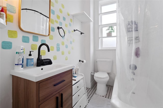 full bathroom with vanity, toilet, a wealth of natural light, and shower / tub combo