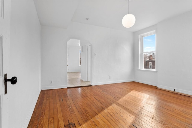 unfurnished room with light hardwood / wood-style floors