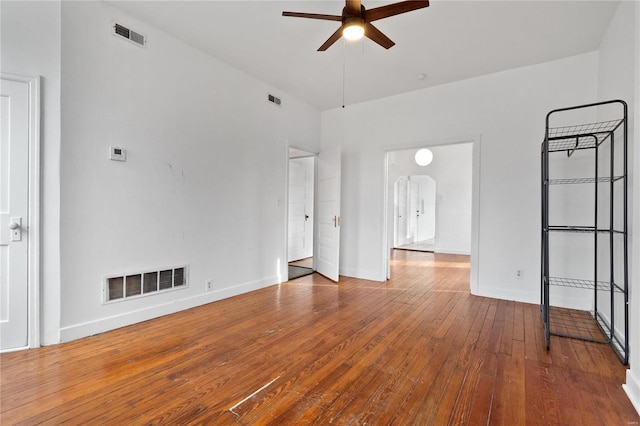 unfurnished room with ceiling fan and wood-type flooring