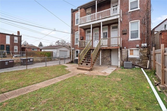 exterior space with a yard and central AC